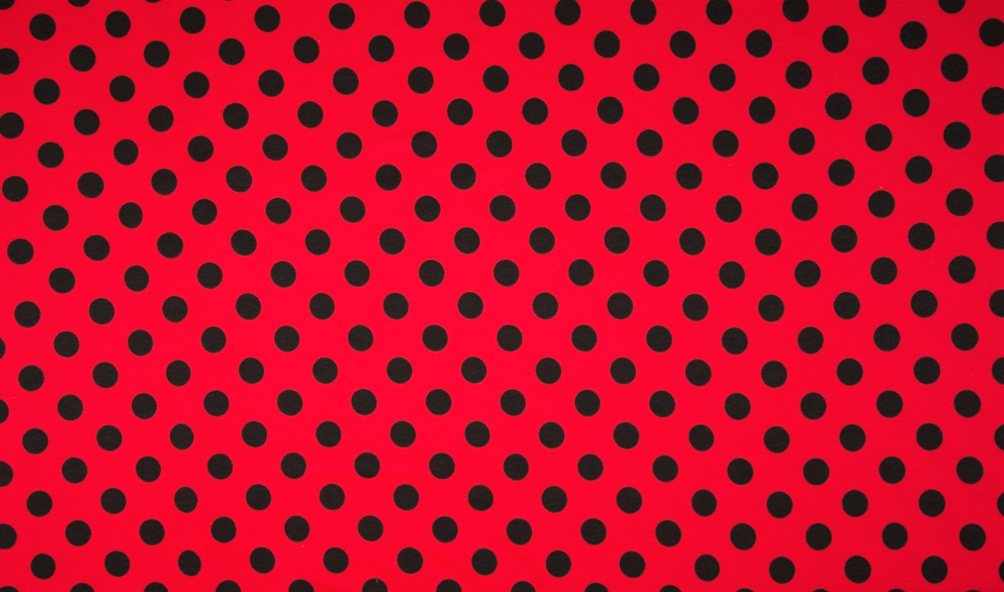 Baumwolljersey rot mit großen schwarzen Dots
