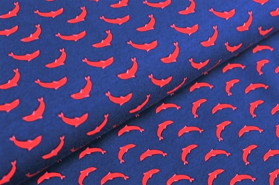 Baumwolljersey navy mit roten Delfinen